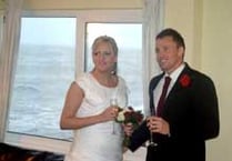Storm batters seaside village as couple marry