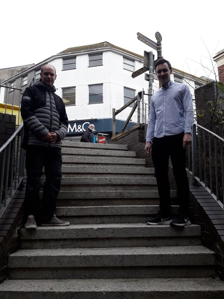 Nick Craker and Lewis Chant-Seeley on the steps down to Liskeard’s Poundland store which have been given a tidy-up.