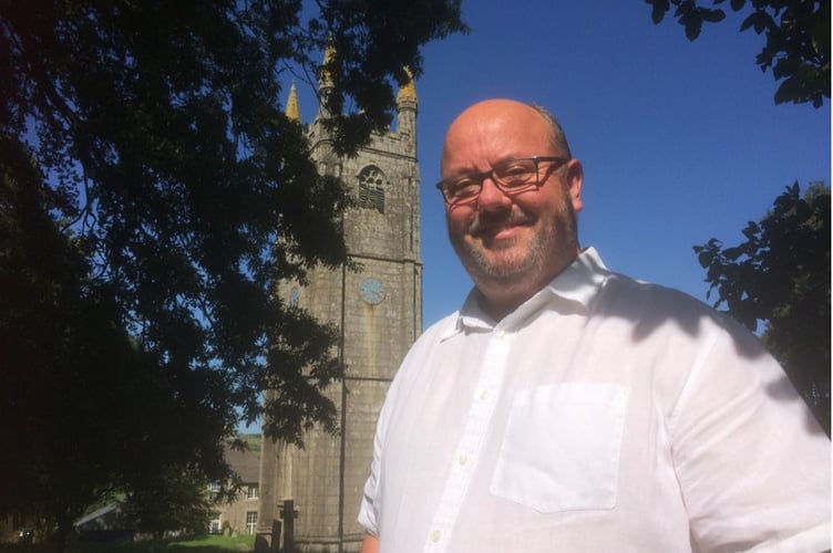 Ian Banbury, St Cleer Ringers’ Tower Captain, in front of St Cleer’s parish church which is dedicated to St Clarus.