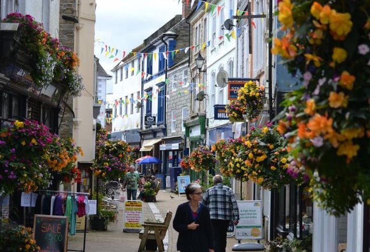 A summer scene in Liskeard’s Fore Street with colourful floral displays