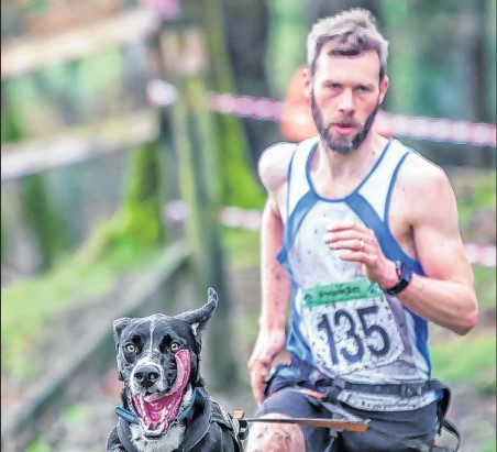 Ian Littlewood running with his dog Ed.