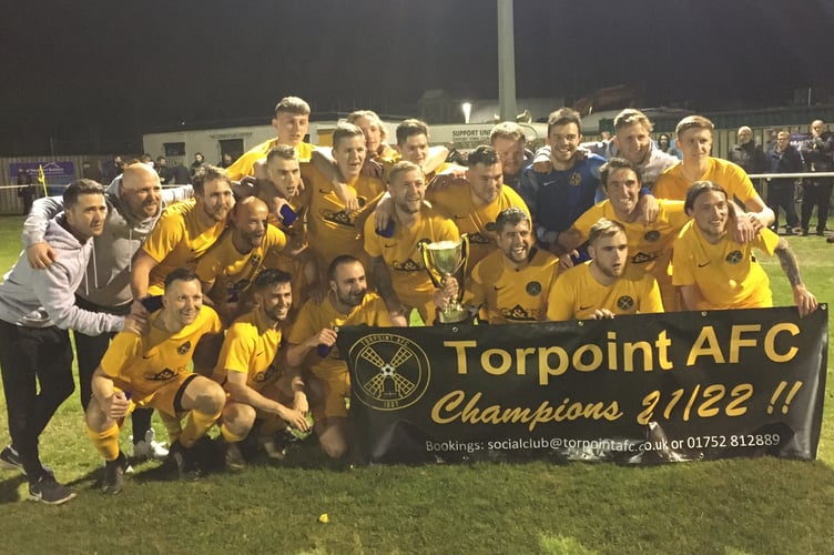 Torpoint’s players and coaches celebrate their title-winning success