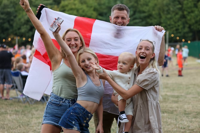 England fans celebrating during England vs Germany Euro 2022 final match on the big screen in the grounds of Tamworth Castle in Staffordshire. 31/07/2022