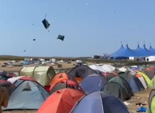A tornado swept through Boardmasters Festival sending tents flying into the air and into campers. See SWNS story SWSYtornado; Steven Peddle, 32, took a clip around midday yesterday [13], showing tents being whipped up by wind around in a circle just near the main arena. Music fans watched on in shock as the tents circled in the air around 100 metres off the ground with one even colliding and wrapping itself around an unsuspecting person.       
