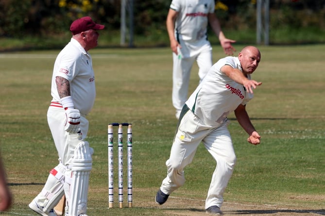Luckett’s Martin Budge bowls as batsman Mark Trudgeon watches on during Saturday’s clash at Lanhydrock Seconds which Luckett won by eight wickets.
