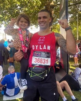 Dylan Peel and his daughter after running the marathon for the British Heart Foundation