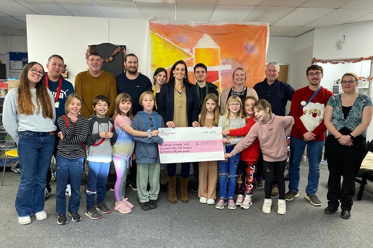 Members of The Lighthouse Community Centre holding their cheque from the National Lottery fund