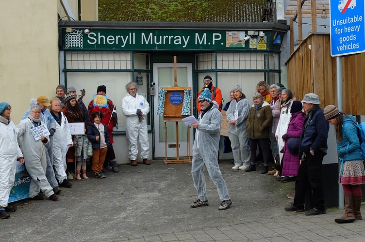 Some of the protestors outside of the MP's office in Liskeard