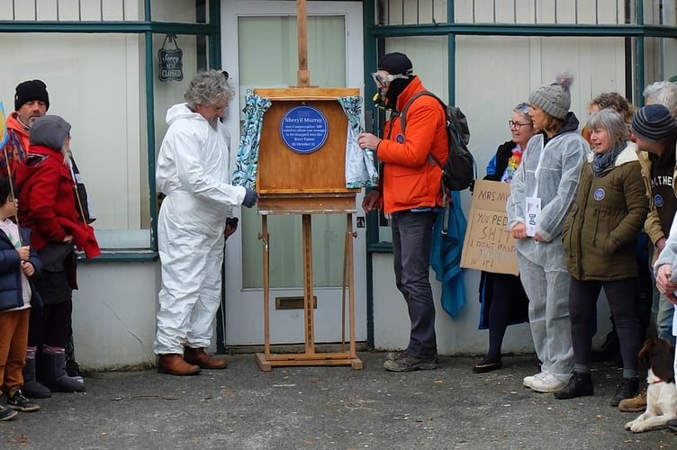 The blue plaque being unveiled outside the MP's office in Liskeard