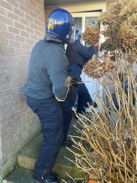 Police carrying out the raid at a property in Bodmin