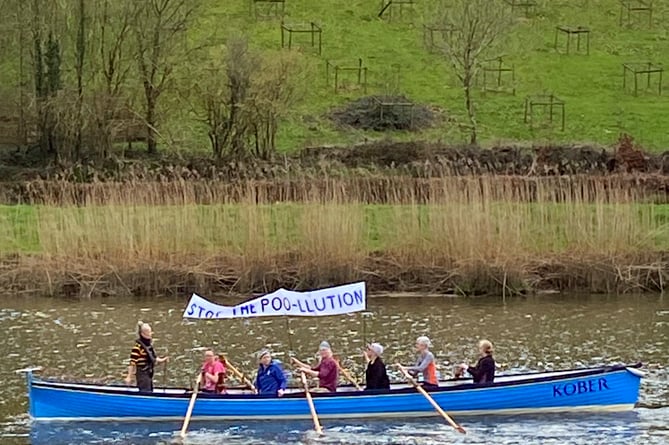 The gig which rowed up the River Tamar with a 'stop the poo-llution' banner