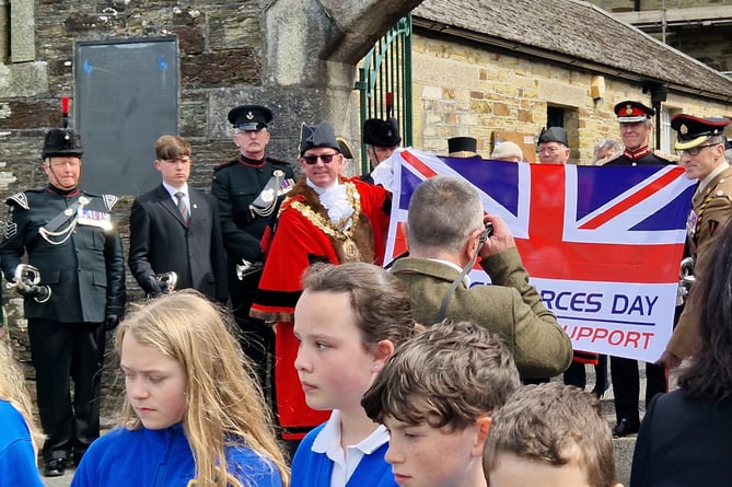 SCHOOLCHILDREN took part in the Armed Forces Day flag relay event