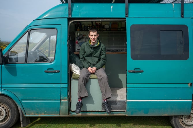 **Sent under embargo - no use before 20.00 BST May 16 2023**
Van dweller Kieran Lewis in Liskeard, Cornwall. He moved into his self converted van almost 2 years ago. See SWNS story SWNJvan. A man "priced out" of buying a property in his Cornish hometown by second home owners has resorted to living in - a van. Kieran Lewis, 23, says picturesque Looe - the setting for a hit BBC drama - has become unaffordable for locals. So he decided to spend Â£6,000 renovating a Volkswagen van - which he now lives in full-time. Delivery driver Kieran has no regrets and is hoping to set up a van conversion business with his savings.  

 
