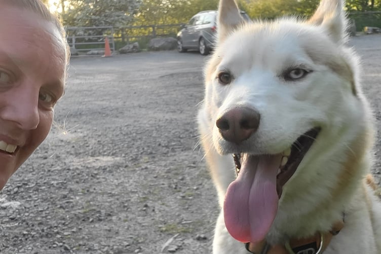 Rebecca Dustan alongside Mike's dog, Enzo