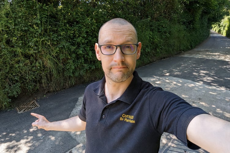 Cllr Colin Martin celebrating a newly resurfaced pothole.