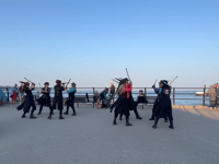 Sunset morris dancing on Looe seafront 
