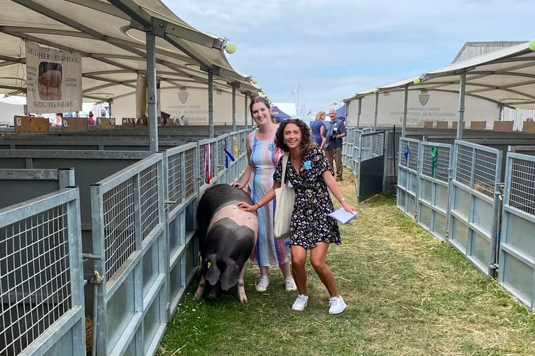Zoe Uglow and Scarlett Hills-Brooks helped bring Michael Brown's pig back to her pen