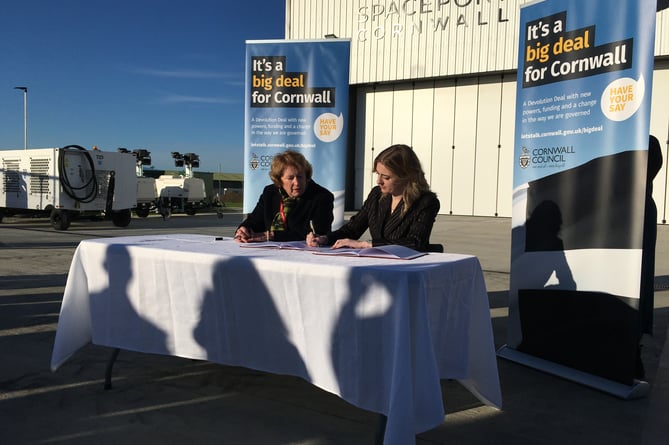 Cornwall Council leader Linda Taylor and Levelling Up minister Dehanna Davison signing the previous Cornwall Devolution deal at Spaceport Cornwall 