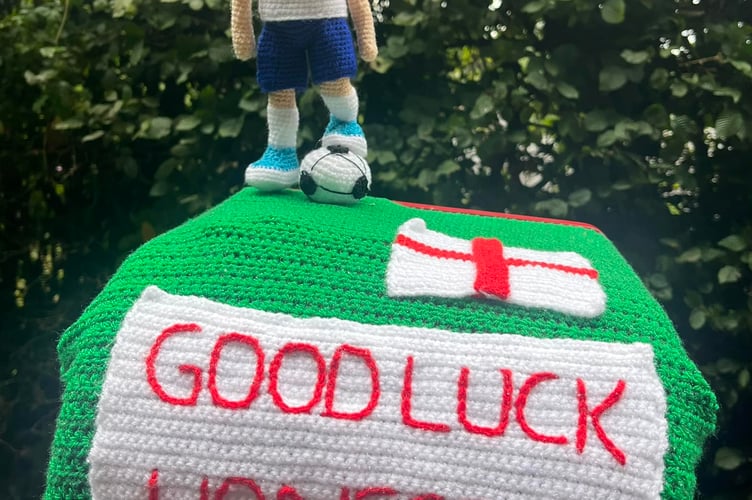 The knitted decoration which can be seen on top of the post box in St Mellion