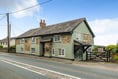 Former smithy for sale has a hidden section behind a bookshelf