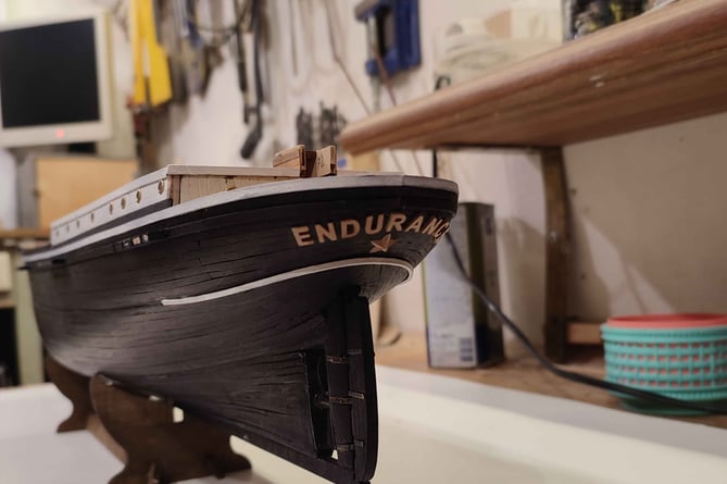 A Ukrainian man is building model ships fit for show in a museum from the middle of a war zone being constantly bombed. Vitaliy Vribel, 64, is currently making a model of Ernest Shackleton's ship Endurance (pictured in construction) after being commissioned by the Shipwreck Treasure Museum, in Charlestown, Cornwall. See SWNS story SWPLshipwreck. Shackletonâs ship was famously crushed in ice during his bid to cross Antarctica more than a century ago and Vitaliy's model will be shown in the museum as part of their exhibition about the polar explorer once completed and it "somehow finds its way from Ukraine to Cornwall", the museum said. The retired engineer is carefully creating the ship in the loft of his fourth floor apartment in Dnipro - a city in Ukraine that is constantly being bombed in the ongoing conflict. His commission came about after the museum's managing director saw Vitaliy's daughter, Nataliia, appeal on LinkedIn for a safe place for her father's models during the conflict.