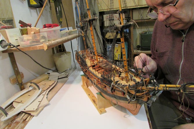 A Ukrainian man is building model ships fit for show in a museum from the middle of a war zone being constantly bombed. Vitaliy Vribel, 64, (pictured making one of his models) is currently making a model of Ernest Shackleton's ship Endurance after being commissioned by the Shipwreck Treasure Museum, in Charlestown, Cornwall. See SWNS story SWPLshipwreck. Shackletons ship was famously crushed in ice during his bid to cross Antarctica more than a century ago and Vitaliy's model will be shown in the museum as part of their exhibition about the polar explorer once completed and it "somehow finds its way from Ukraine to Cornwall", the museum said. The retired engineer is carefully creating the ship in the loft of his fourth floor apartment in Dnipro - a city in Ukraine that is constantly being bombed in the ongoing conflict. His commission came about after the museum's managing director saw Vitaliy's daughter, Nataliia, appeal on LinkedIn for a safe place for her father's models during the conflict.