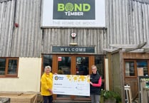 Swimming success for WH Bond boss raises £6,670 for Marie Curie