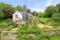 "Delightful" farmhouse for sale has countryside views and stables