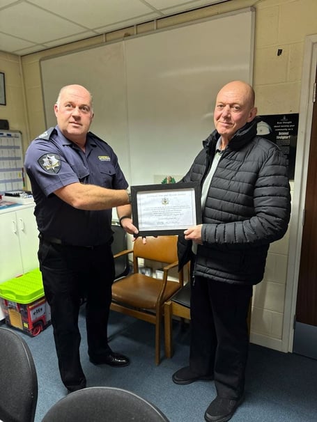 Hewie Hewitson receiving his certificate