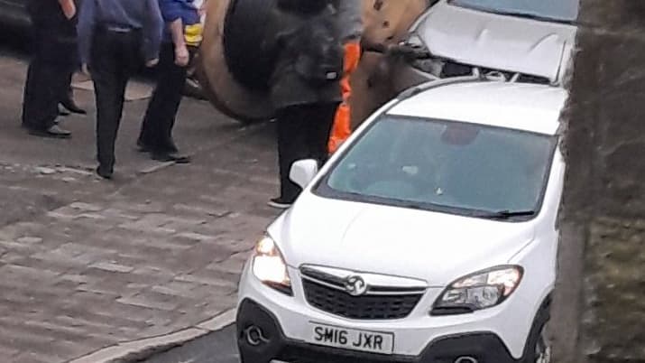 Cars damaged after large wire reel escapes trailer in Bodmin