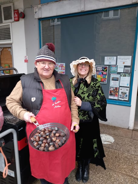 Members from the Liskeard Traders Association roasting chestnuts