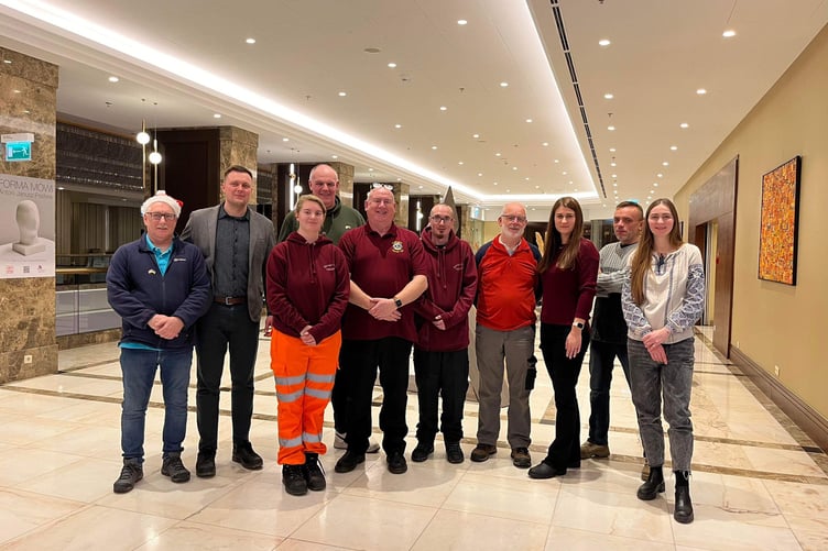 Pictured here is some of the convoy team alongside Bogdan Kelichavyi, his wife and two members from the humanitarian hub in Warsaw at the signing