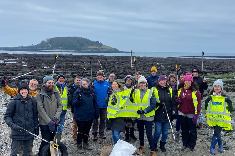 Volunteers on the Hannafore beach during this year’s annual New Year beach clean