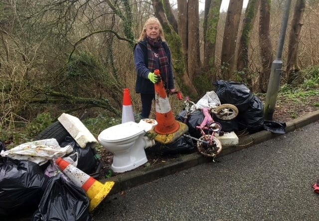 Cllr Jane Pascoe stood next to a recent case of fly tipping