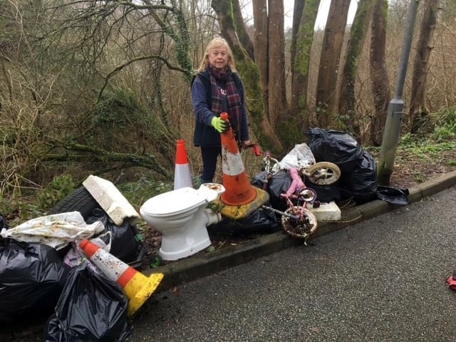 Cllr Jane Pascoe stood next to a recent case of fly tipping