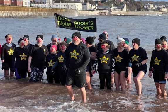 Singers braved the cold to sing in the sea for charity