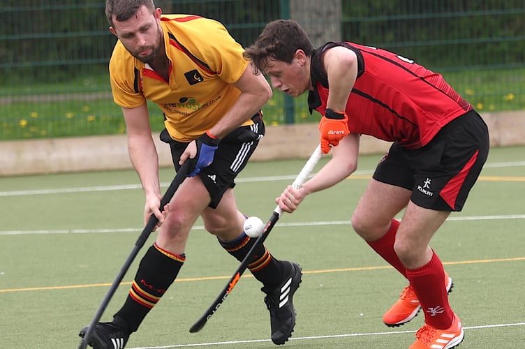 Caradon's Luke Jeffery (left) looks to tackle his opponent during Saturday's clash with Plymouth Marjon Seconds at Lux Park.