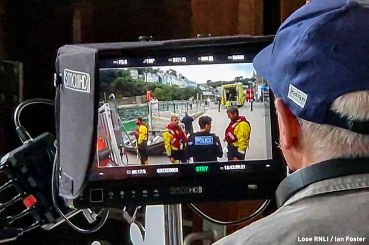 Crew briefing PC Hartford on the lifeboat slipway. (Picture: Looe RNLI/Ian Foster)