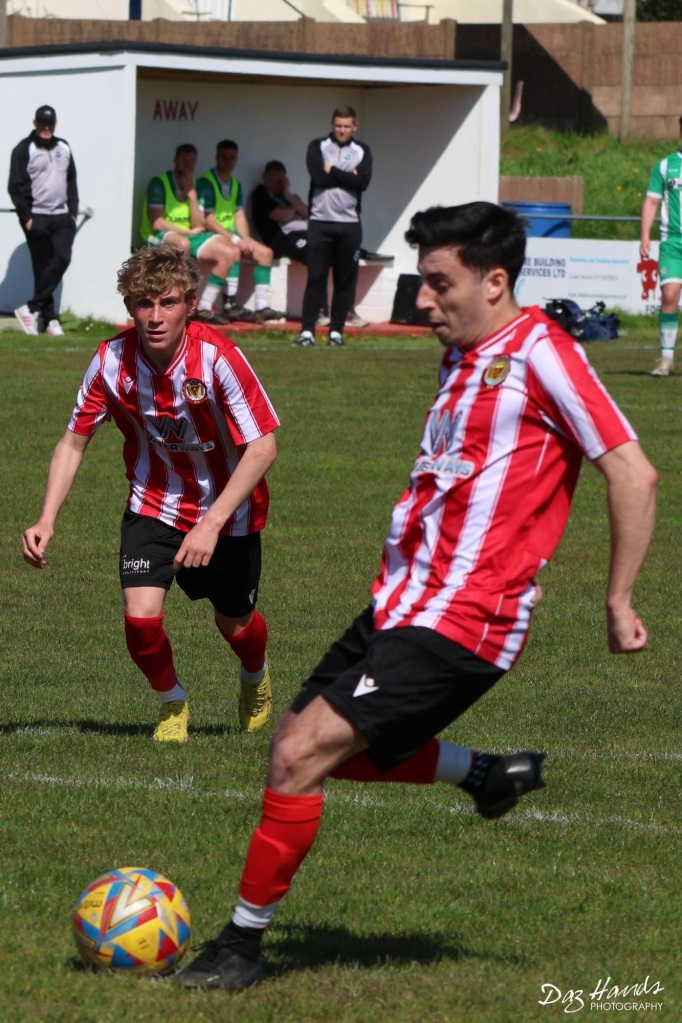 Hat-trick hero Joe Preece slots home a penalty as teenager Jack Jefford, who was making his first Saltash start, watches on.