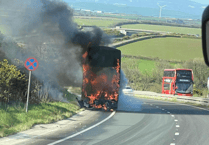Double-decker bus fire causes A30 havoc