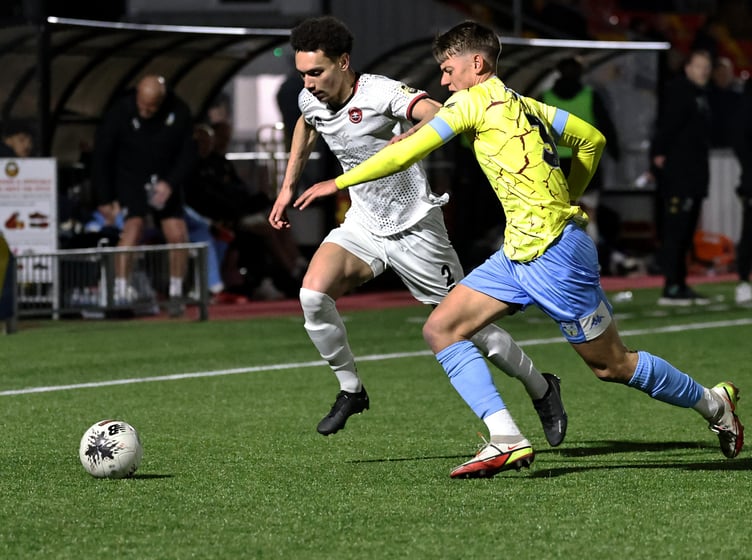 Truro City's James Melhado (left) in action against Weymouth.