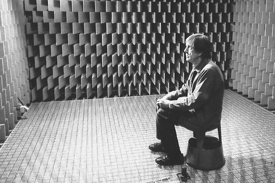 Cage sitting in Harvard University's anechoic chamber, by which he discovered that absolute silence does not exist, inspiring him to compose 4'33"