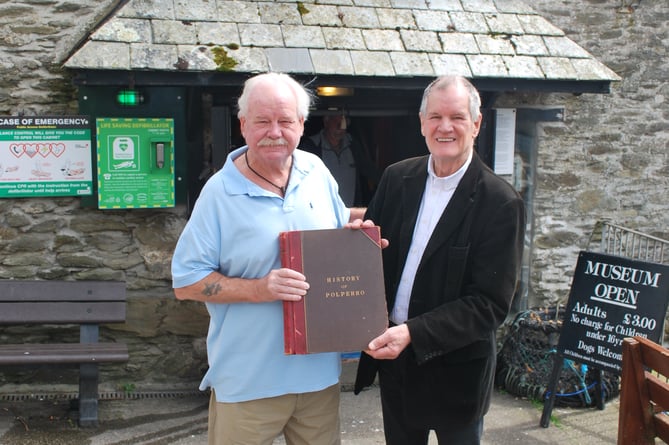 Mike Blackmore of the Polperro Heritage Museum of Smuggling and Fishing and Jeremy Johns from Polperro Heritage Press with the manuscript 