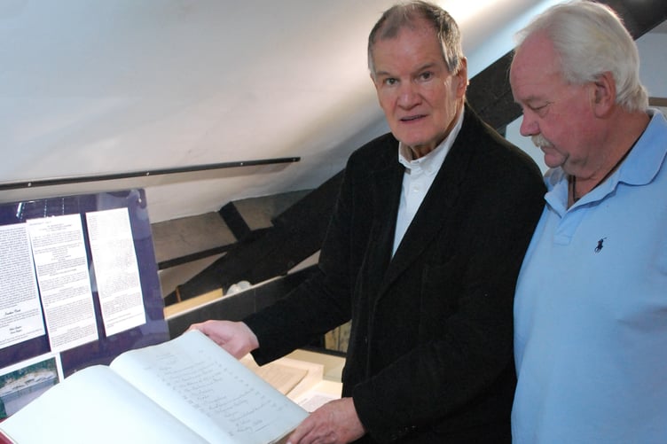 Mike Blackmore and Jeremy Johns taking a look at the book