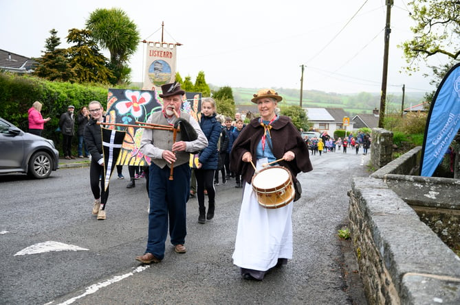 Merv and Alison Davey leading the procession of school children up to the well last year