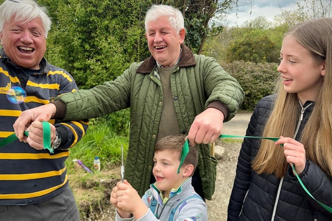 CHAIRMAN of Landulph Parish Council Martin Worth is joined by cllr Martin Howlett and youngsters Joseph Best and Fleur Pearson in declaring the community orchard offically open