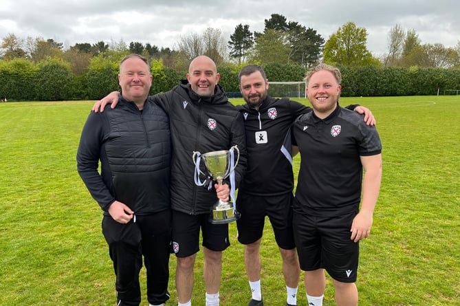 St Austell's coaching team of Chris Knight (manager), James Powell (assistant manager), Craig Ainslie (first team coach) and Luke Perkes (physio and coach) celebrate with the SWPL Premier West title. Picture: Kevin Marriott