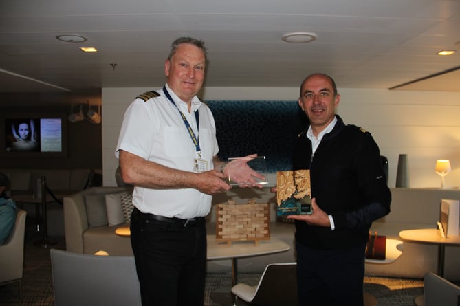 Fowey harbour master Captain Paul Thomas exchanged plaques with Captain Divorcing