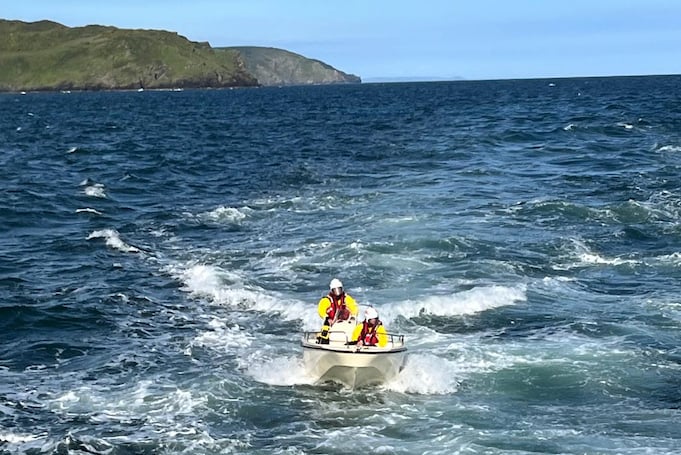 The lifeboatmen on the dory followed the Fowey lifeboat back to the harbour. Picture: Fowey RNLI