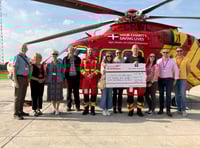 Looe Pioneers hand over cheque to Cornwall Air Ambulance